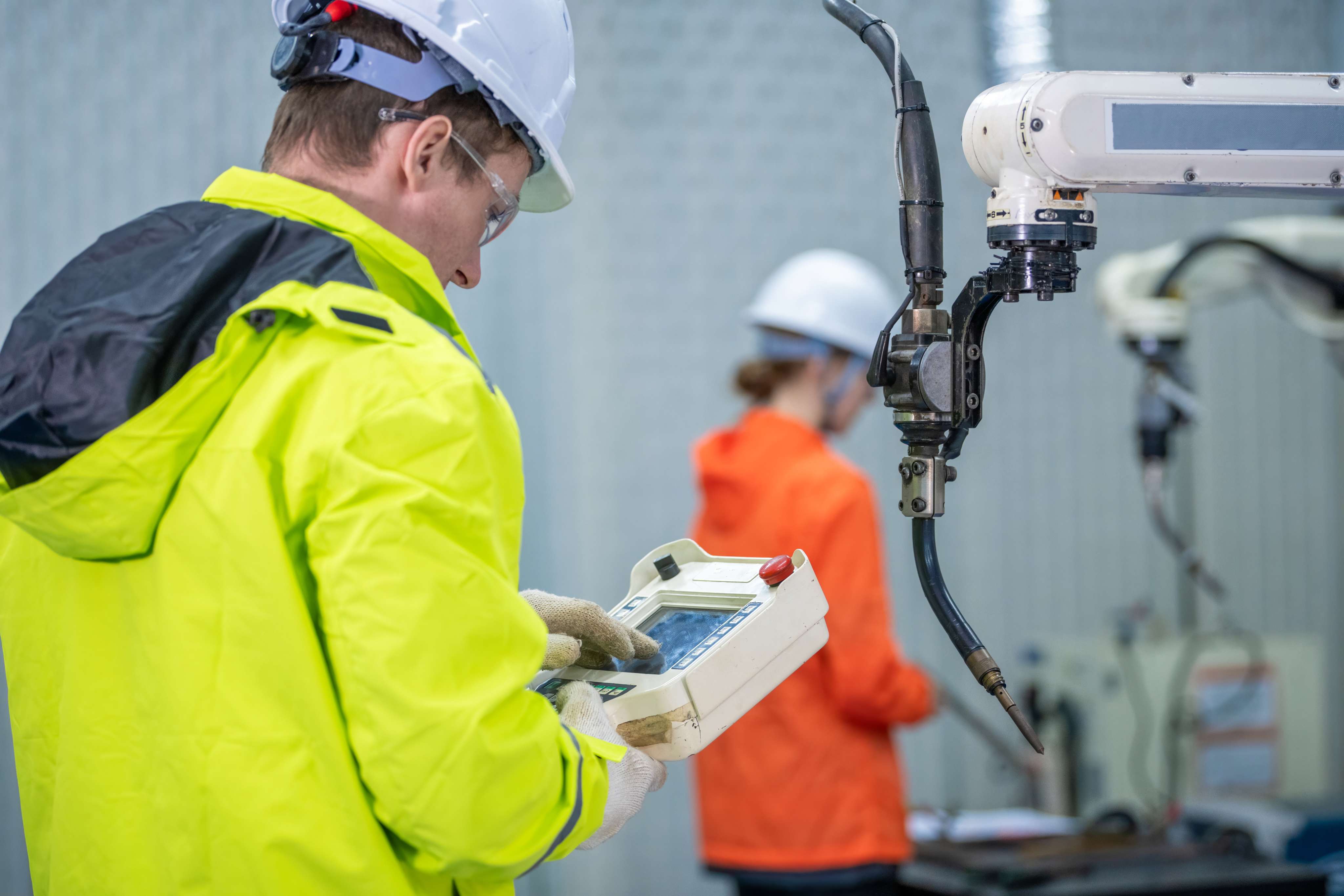 Engineer with robot arm